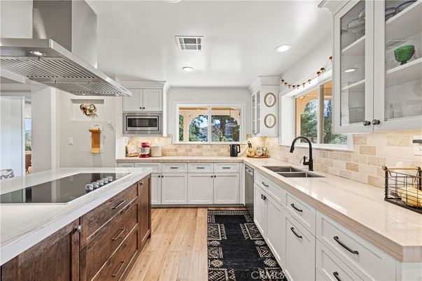 Interior, Kitchen, Recessed Lighting, Tile Countertops, Wood Texture Flooring