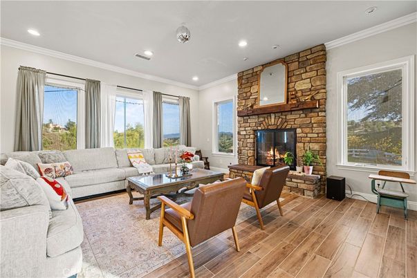 Fireplace, Interior, Living room, Recessed Lighting, Stone Walls, Wood Texture Flooring