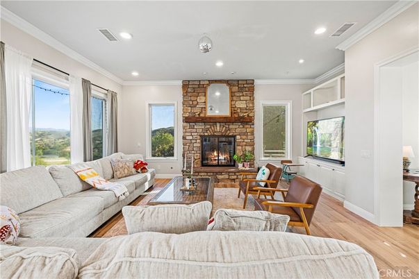 Fireplace, Interior, Living room, Recessed Lighting, Stone Walls, Wood Texture Flooring
