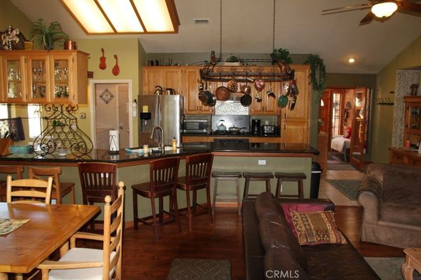 Dining room, Interior, Kitchen, Living room, Pendant Lights, Recessed Lighting, Stainless Steel Appliances, Wood Texture Flooring