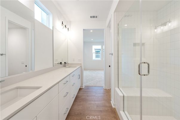 Bathroom, Dual Sink Vanities, Glass Shower, Interior, Recessed Lighting, Wood Texture Flooring