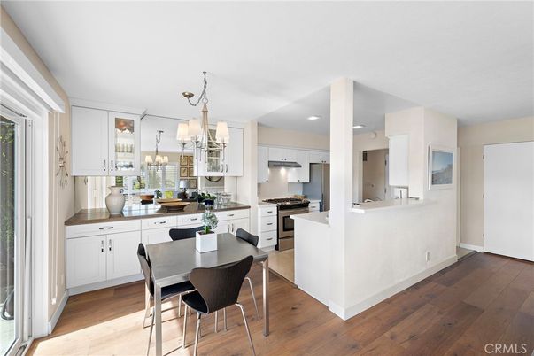 Chandelier, Dining room, Interior, Kitchen, Recessed Lighting, Stainless Steel Appliances, Wood Texture Flooring