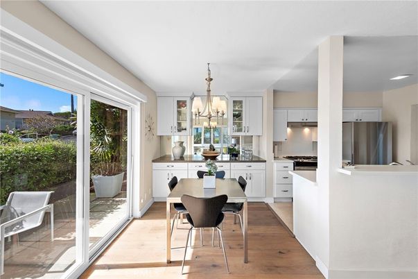 Dining room, Interior, Kitchen, Pendant Lights, Recessed Lighting, Stainless Steel Appliances, Wood Texture Flooring