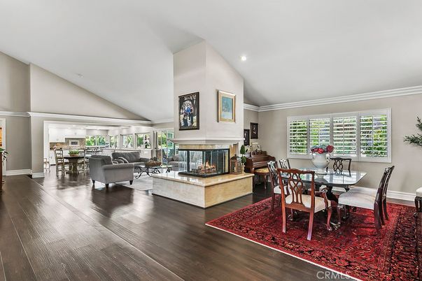 Dining room, Fireplace, Interior, Living room, Recessed Lighting, Wood Texture Flooring