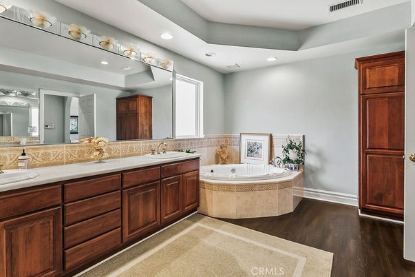 Bathroom, Dual Sink Vanities, Interior, Recessed Lighting, Wood Texture Flooring