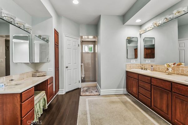 Bathroom, Dual Sink Vanities, Glass Shower, Interior, Recessed Lighting, Wood Texture Flooring