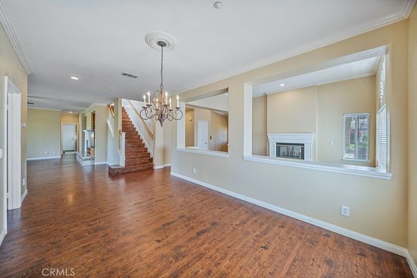 Chandelier, Empty room, Fireplace, Interior, Recessed Lighting, Wood Texture Flooring