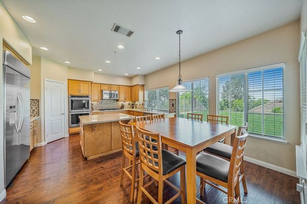 Dining room, Interior, Kitchen, Pendant Lights, Recessed Lighting, Stainless Steel Appliances, Wood Texture Flooring