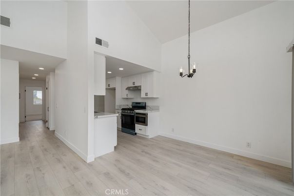 Chandelier, Interior, Kitchen, Pendant Lights, Recessed Lighting, Stainless Steel Appliances, Wood Texture Flooring