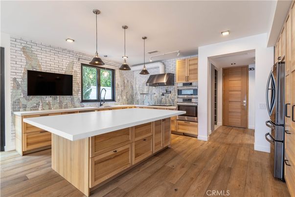 Interior, Kitchen, Pendant Lights, Recessed Lighting, Stainless Steel Appliances, Stone Walls, Wood Texture Flooring