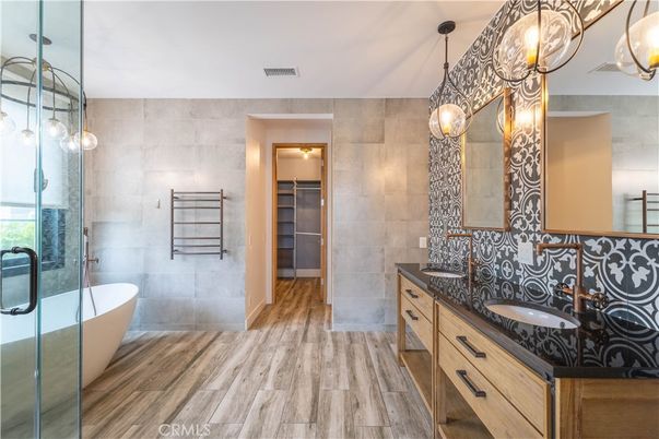 Bathroom, Dual Sink Vanities, Free Standing Baths, Glass Shower, Interior, Pendant Lights, Walk-in Closets, Wood Texture Flooring