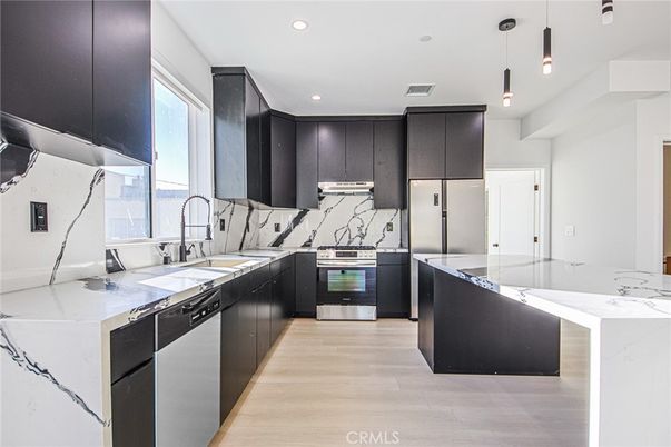 Interior, Kitchen, Pendant Lights, Recessed Lighting, Stainless Steel Appliances, Wood Texture Flooring