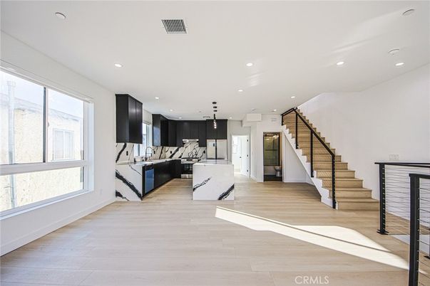Interior, Kitchen, Marble Walls, Pendant Lights, Recessed Lighting, Stainless Steel Appliances, Wood Texture Flooring