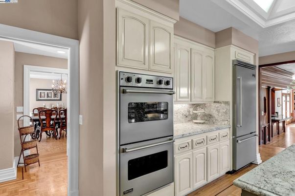 Chandelier, Dining room, Interior, Kitchen, Recessed Lighting, Stainless Steel Appliances, Wood Texture Flooring