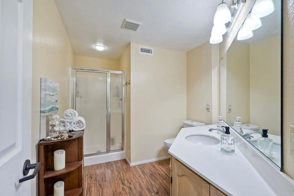 Bathroom, Dual Sink Vanities, Glass Shower, Interior, Wood Texture Flooring