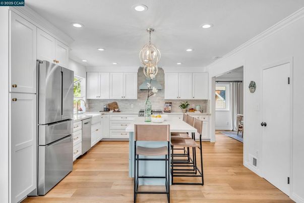 Dining room, Interior, Kitchen, Pendant Lights, Recessed Lighting, Stainless Steel Appliances, Wood Texture Flooring