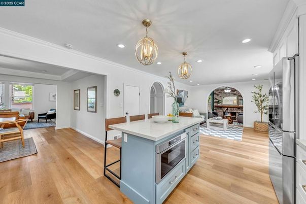 Chandelier, Dining room, Fireplace, Interior, Kitchen, Living room, Pendant Lights, Recessed Lighting, Wood Texture Flooring