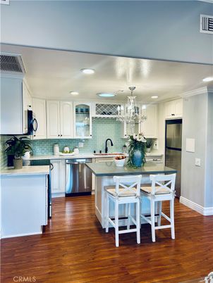 Chandelier, Dining room, Interior, Kitchen, Recessed Lighting, Stainless Steel Appliances, Wood Texture Flooring