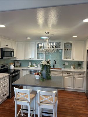 Chandelier, Interior, Kitchen, Recessed Lighting, Stainless Steel Appliances, Wood Texture Flooring