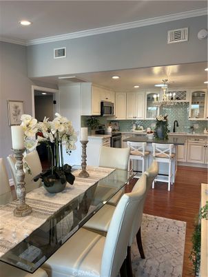 Chandelier, Dining room, Interior, Kitchen, Recessed Lighting, Stainless Steel Appliances, Wood Texture Flooring
