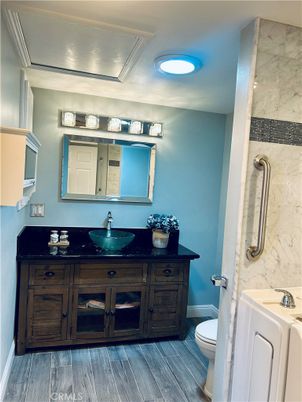 Bathroom, Dual Sink Vanities, Interior, Marble Walls, Wood Texture Flooring