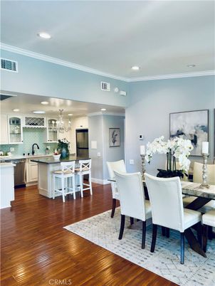 Chandelier, Dining room, Interior, Kitchen, Recessed Lighting, Stainless Steel Appliances, Wood Texture Flooring