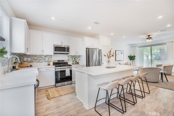 Dining room, Interior, Kitchen, Recessed Lighting, Stainless Steel Appliances, Wood Texture Flooring