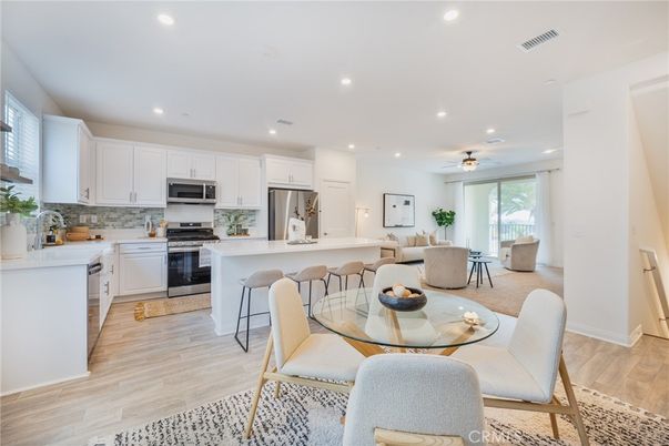 Dining room, Interior, Kitchen, Recessed Lighting, Stainless Steel Appliances, Wood Texture Flooring
