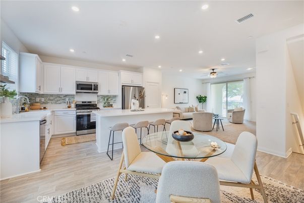 Dining room, Interior, Kitchen, Recessed Lighting, Stainless Steel Appliances, Wood Texture Flooring