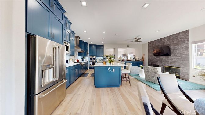 Fireplace, Interior, Kitchen, Recessed Lighting, Stainless Steel Appliances, Stone Walls, Wood Texture Flooring