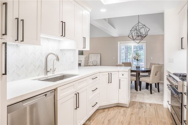 Dining room, Interior, Kitchen, Pendant Lights, Recessed Lighting, Stainless Steel Appliances, Wood Texture Flooring