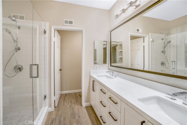 Bathroom, Dual Sink Vanities, Glass Shower, Interior, Wood Texture Flooring
