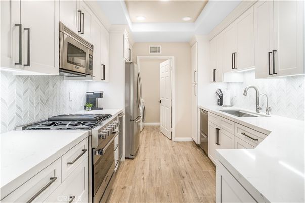 Interior, Kitchen, Recessed Lighting, Stainless Steel Appliances, Wood Texture Flooring