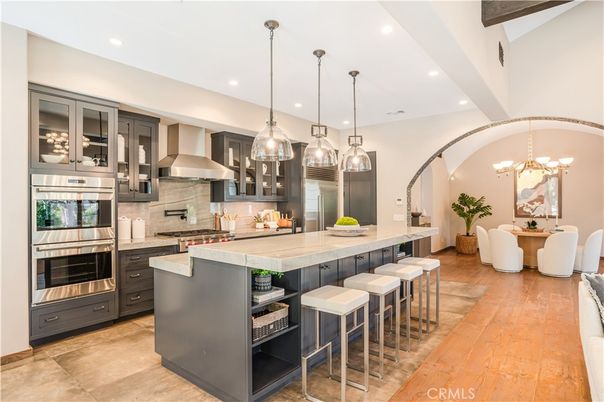Chandelier, Dining room, Interior, Kitchen, Pendant Lights, Recessed Lighting, Stainless Steel Appliances, Wood Texture Flooring