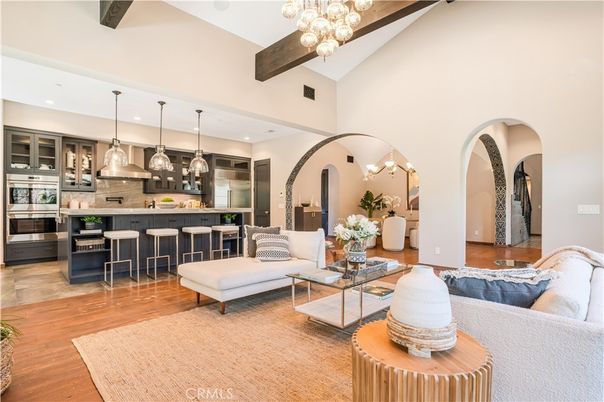 Chandelier, Interior, Kitchen, Living room, Pendant Lights, Recessed Lighting, Stainless Steel Appliances, Wooden Beams, Wood Texture Flooring