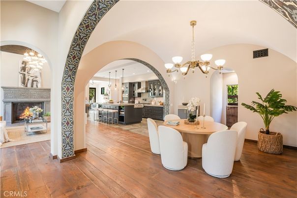 Chandelier, Dining room, Fireplace, Interior, Kitchen, Pendant Lights, Stainless Steel Appliances, Wood Texture Flooring