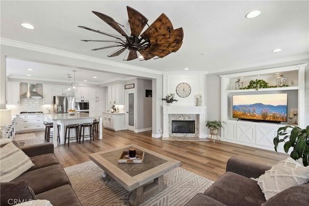 Fireplace, Interior, Kitchen, Living room, Pendant Lights, Recessed Lighting, Stainless Steel Appliances, Wood Texture Flooring