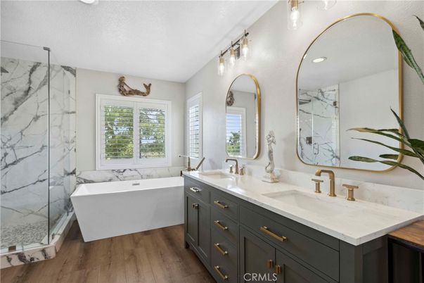 Bathroom, Dual Sink Vanities, Free Standing Baths, Interior, Marble Walls, Recessed Lighting, Wood Texture Flooring