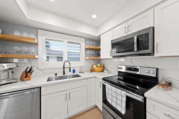 Interior, Kitchen, Marble Walls, Recessed Lighting, Stainless Steel Appliances, Wood Texture Flooring