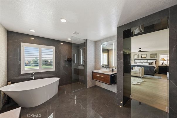 Bathroom, Bedroom, Dual Sink Vanities, Free Standing Baths, Glass Shower, Interior, Recessed Lighting, Wood Texture Flooring