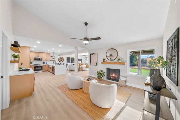 Fireplace, Interior, Kitchen, Living room, Pendant Lights, Recessed Lighting, Stainless Steel Appliances, Wood Texture Flooring