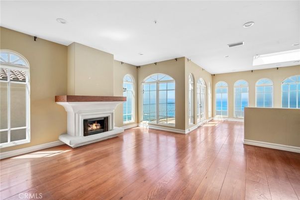 Empty room, Fireplace, Interior, Recessed Lighting, Water, Wood Texture Flooring