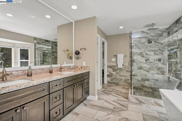 Bathroom, Dual Sink Vanities, Glass Shower, Interior, Marble, Marble Walls, Recessed Lighting