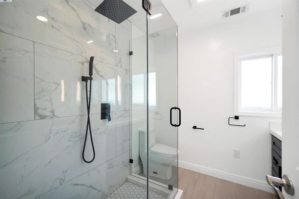 Bathroom, Glass Shower, Interior, Marble Walls, Recessed Lighting, Wood Texture Flooring