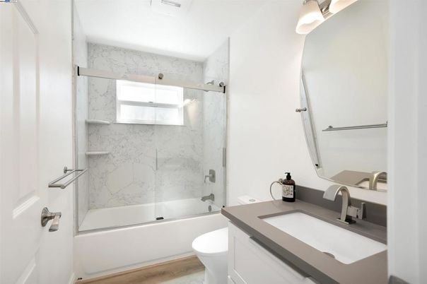 Bathroom, Glass Shower, Interior, Marble Walls, Wood Texture Flooring