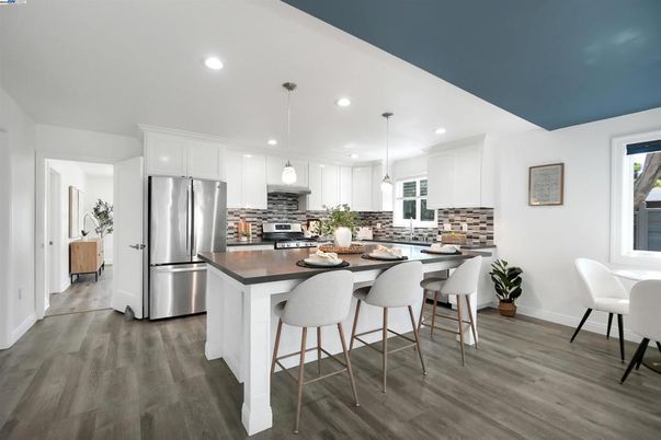 Dining room, Interior, Kitchen, Pendant Lights, Recessed Lighting, Stainless Steel Appliances, Wood Texture Flooring