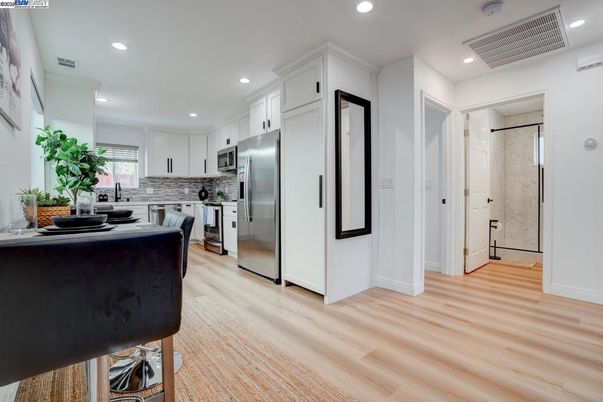 Interior, Kitchen, Marble Walls, Recessed Lighting, Stainless Steel Appliances, Wood Texture Flooring