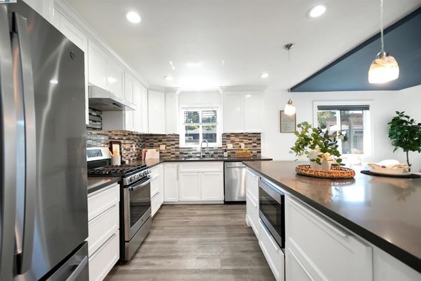 Interior, Kitchen, Pendant Lights, Recessed Lighting, Stainless Steel Appliances, Wood Texture Flooring