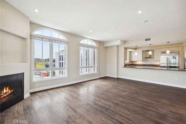 Empty room, Fireplace, Interior, Kitchen, Pendant Lights, Recessed Lighting, Wood Texture Flooring