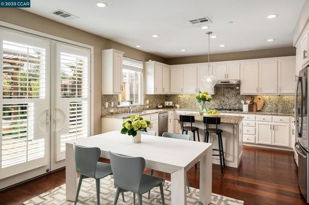 Dining room, Interior, Kitchen, Pendant Lights, Recessed Lighting, Stainless Steel Appliances, Wood Texture Flooring